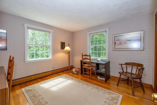 21 Overlook Dr, Chelmsford, MA 01824 - office area featuring a baseboard heating unit, wallpapered walls, light wood-style floors, and healthy amount of natural light