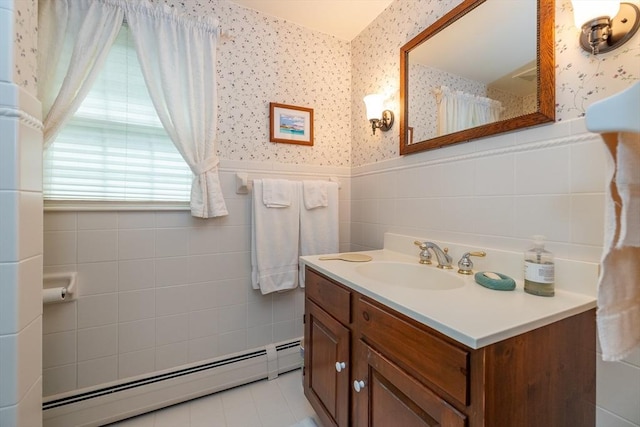 21 Overlook Dr, Chelmsford, MA 01824 - bathroom with baseboard heating, wallpapered walls, vanity, wainscoting, and tile walls