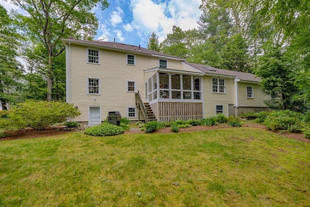 21 Overlook Dr, Chelmsford, MA 01824 - rear view of house with a sunroom, a yard, and stairway