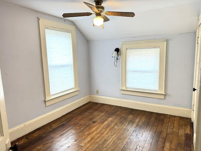 spare room with hardwood / wood-style floors, ceiling fan, baseboards, and lofted ceiling