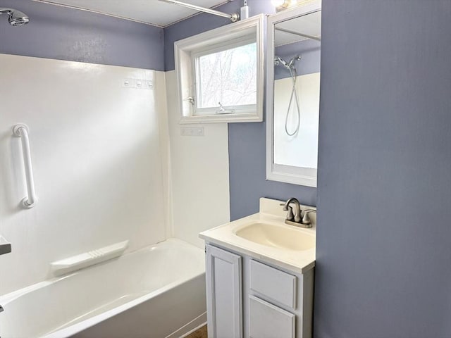 bathroom featuring vanity and bathtub / shower combination