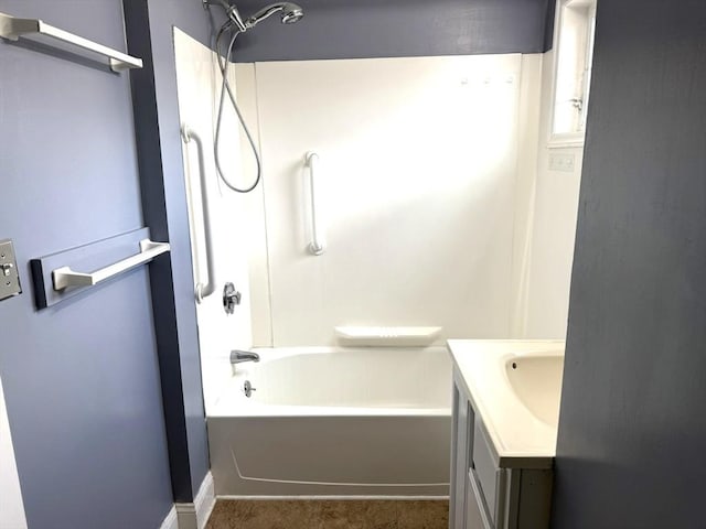 full bathroom featuring vanity, baseboards, and bathtub / shower combination