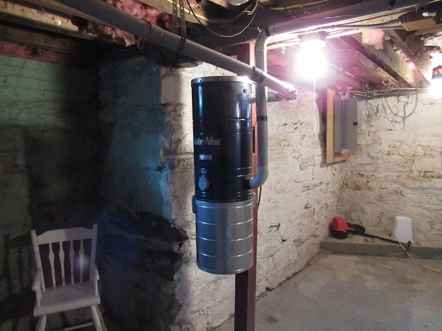 unfinished basement featuring electric panel