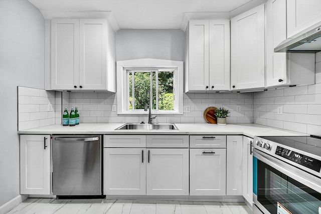30 Forest Park Rd, Woburn, MA 01801 - kitchen with appliances with stainless steel finishes, exhaust hood, white cabinetry, decorative backsplash, and light stone countertops