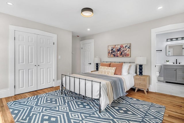 30 Forest Park Rd, Woburn, MA 01801 - bedroom with light wood finished floors, recessed lighting, a closet, and connected bathroom
