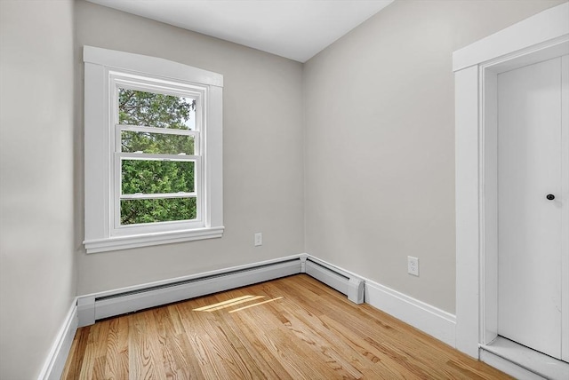 30 Forest Park Rd, Woburn, MA 01801 - unfurnished room featuring wood finished floors and a baseboard heating unit