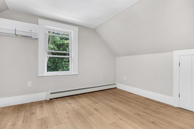 30 Forest Park Rd, Woburn, MA 01801 - bonus room with a baseboard radiator, vaulted ceiling, light wood finished floors, and a wall mounted air conditioner