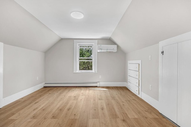 30 Forest Park Rd, Woburn, MA 01801 - bonus room featuring a wall mounted air conditioner, baseboard heating, light wood-type flooring, and vaulted ceiling