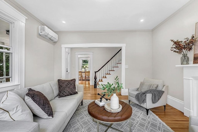 30 Forest Park Rd, Woburn, MA 01801 - living area featuring a wall mounted AC, stairs, wood finished floors, and ornamental molding