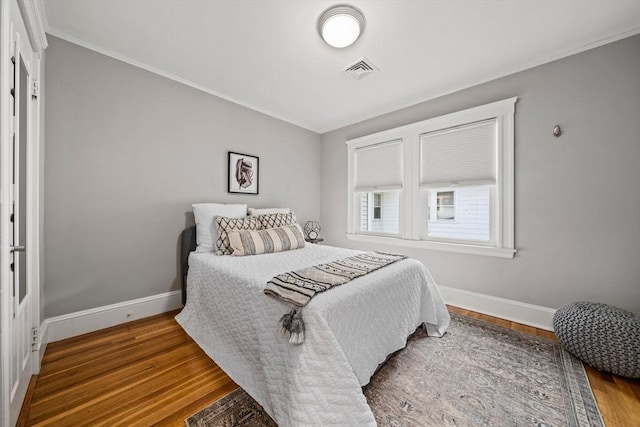 324 Mount Auburn St Unit 2, Watertown, MA 02472 - bedroom with ornamental molding and wood finished floors