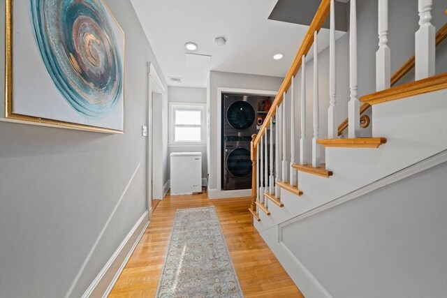 324 Mount Auburn St Unit 2, Watertown, MA 02472 - foyer entrance with stacked washer and clothes dryer, wood finished floors, stairs, and recessed lighting