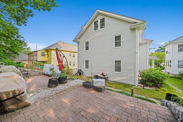 324 Mount Auburn St Unit 2, Watertown, MA 02472 - rear view of house with a patio