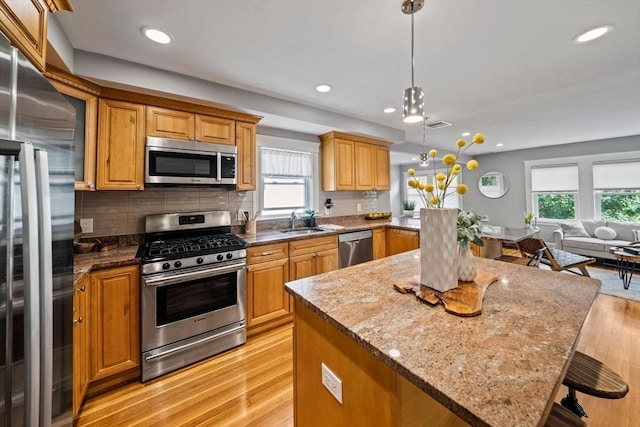 324 Mount Auburn St Unit 2, Watertown, MA 02472 - kitchen with stainless steel appliances, healthy amount of natural light, open floor plan, light wood-type flooring, and recessed lighting