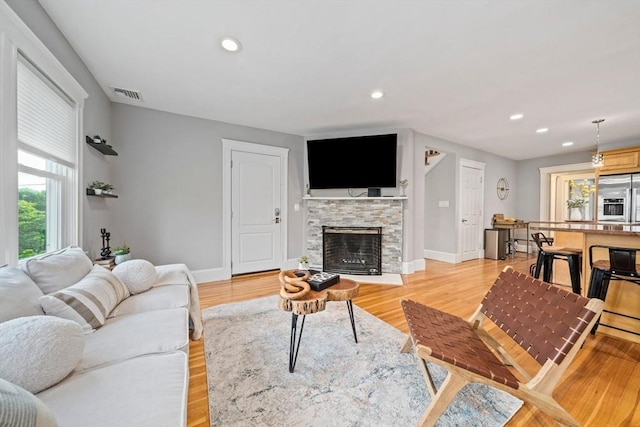 324 Mount Auburn St Unit 2, Watertown, MA 02472 - living area with light wood-style floors, a fireplace, and recessed lighting
