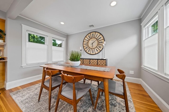324 Mount Auburn St Unit 2, Watertown, MA 02472 - dining area featuring healthy amount of natural light, crown molding, light wood finished floors, and recessed lighting