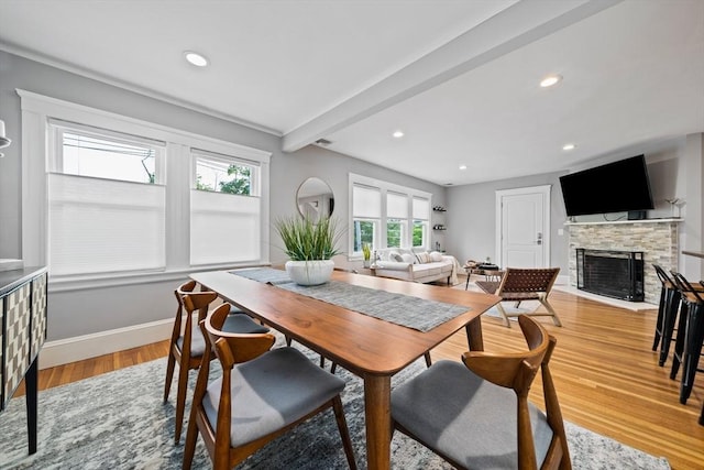 324 Mount Auburn St Unit 2, Watertown, MA 02472 - dining space featuring healthy amount of natural light, a stone fireplace, light wood finished floors, recessed lighting, and beamed ceiling