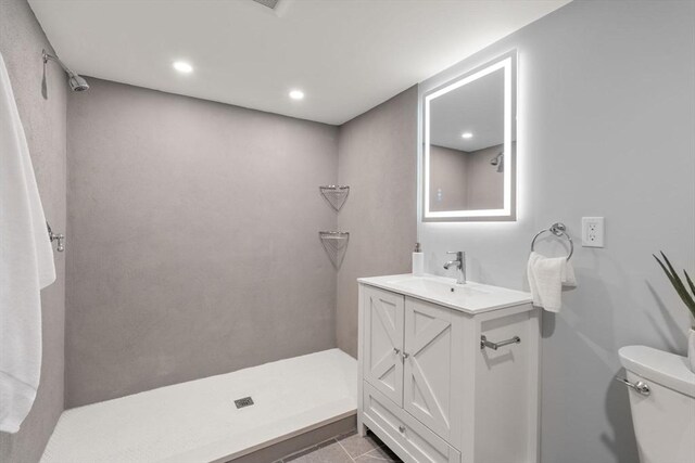 bathroom with vanity, a shower, toilet, recessed lighting, and tile patterned floors