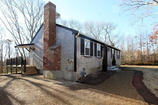 view of side of home with a chimney