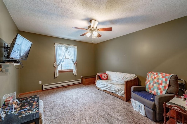 living area with carpet flooring, baseboard heating, and a textured ceiling