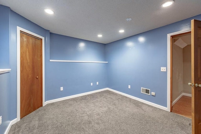 unfurnished room with carpet flooring