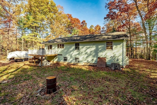 rear view of house featuring a deck