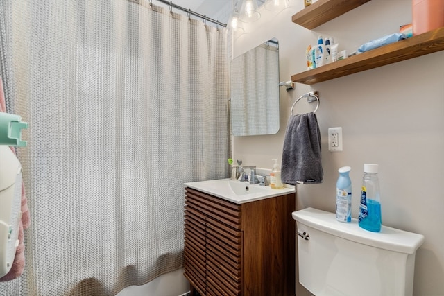 bathroom with vanity, toilet, and a shower with shower curtain