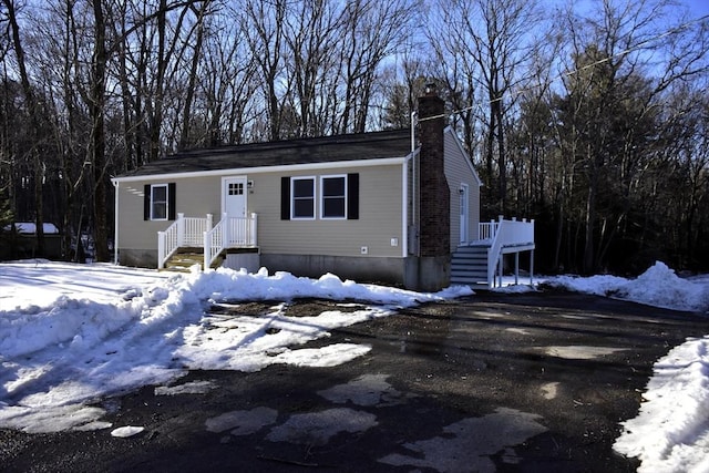 view of front of property featuring a chimney