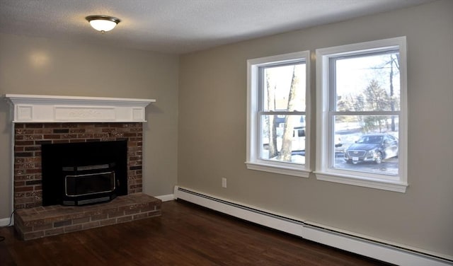 unfurnished living room featuring baseboards, a textured ceiling, a baseboard heating unit, and dark wood-style flooring