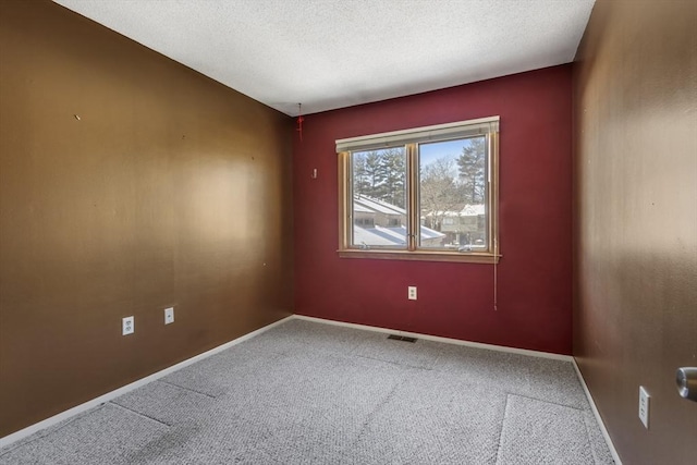 unfurnished room with carpet flooring