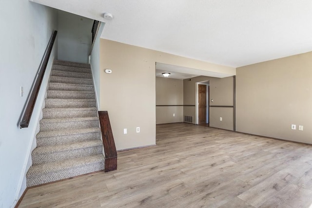 staircase featuring hardwood / wood-style floors