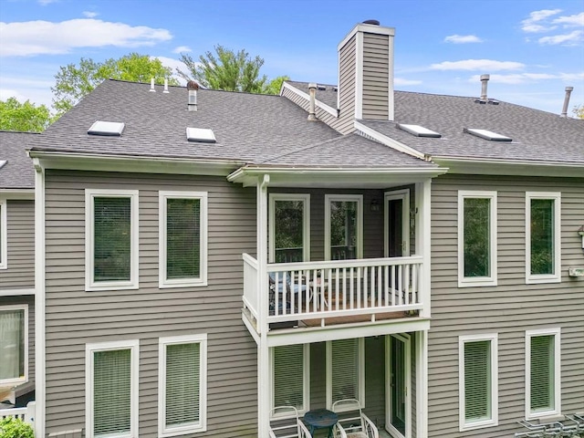 44 Bay Farm Rd Unit 44, Duxbury, MA 02332 - back of property with a shingled roof, a chimney, and a balcony