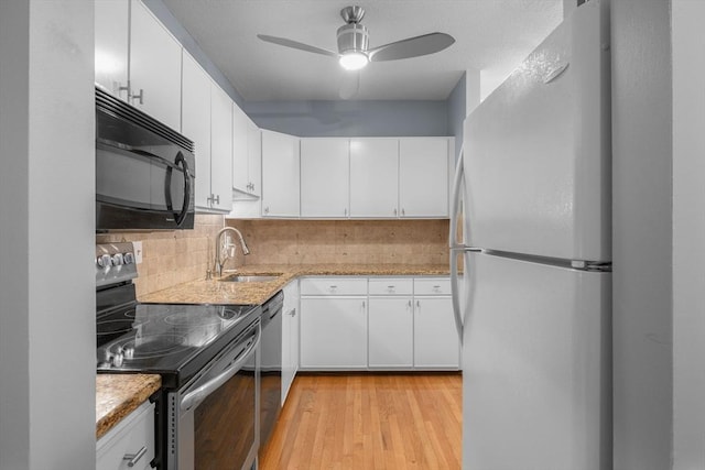 44 Bay Farm Rd Unit 44, Duxbury, MA 02332 - kitchen featuring freestanding refrigerator, black microwave, stainless steel range with electric cooktop, a sink, and backsplash