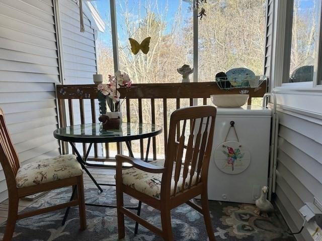 sunroom / solarium featuring plenty of natural light