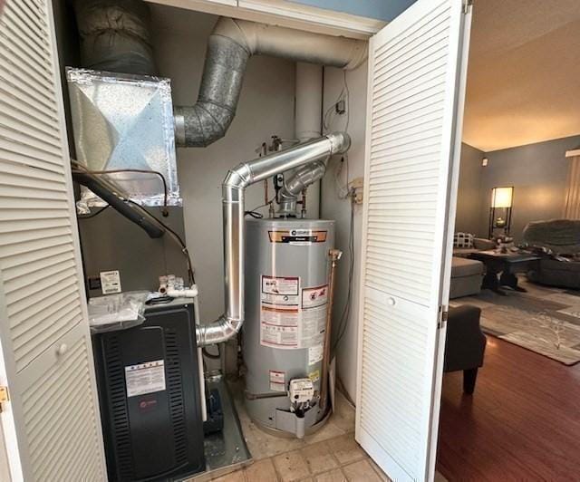 utility room featuring water heater