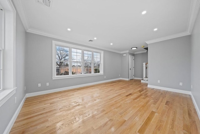 interior space featuring a healthy amount of sunlight, light wood-type flooring, and ornamental molding