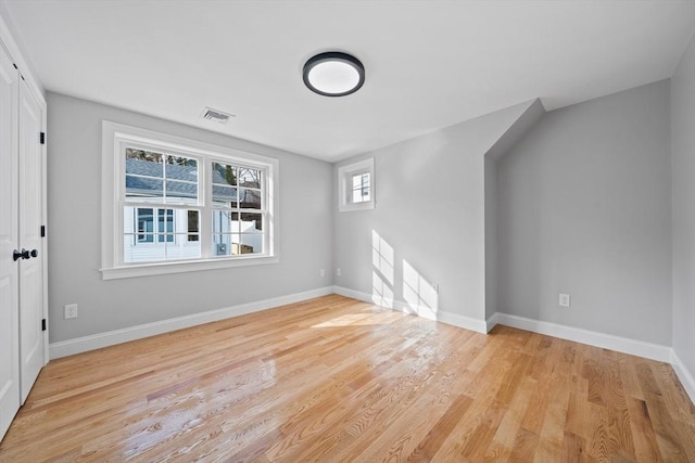 unfurnished room with light hardwood / wood-style floors