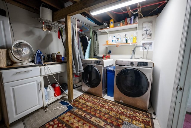 clothes washing area featuring washer and clothes dryer