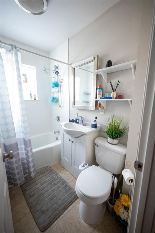 full bathroom featuring tile patterned floors, vanity, toilet, and shower / bath combo