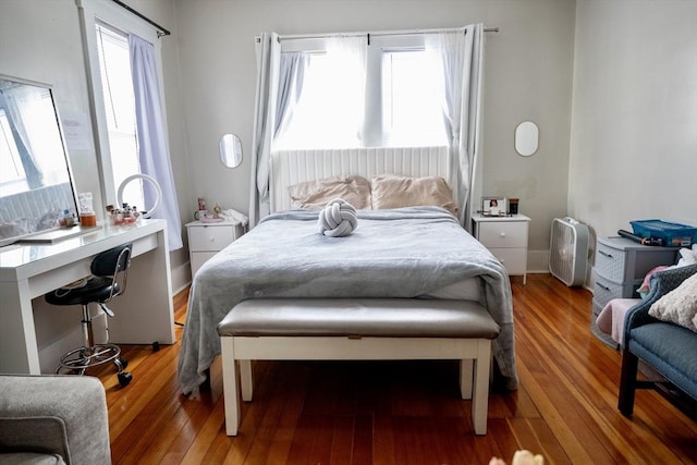 bedroom with hardwood / wood-style flooring