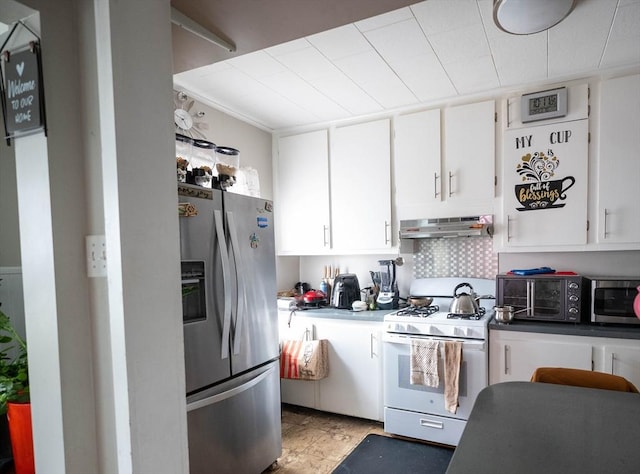 kitchen featuring stainless steel appliances, white cabinets, and decorative backsplash