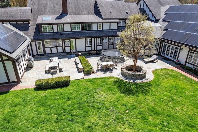 12 Old Meadow Rd, Dover, MA 02030 - rear view of property featuring a patio area, french doors, and a lawn