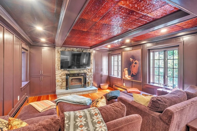 12 Old Meadow Rd, Dover, MA 02030 - living room featuring crown molding, wood finished floors, a baseboard heating unit, a fireplace, and a decorative wall