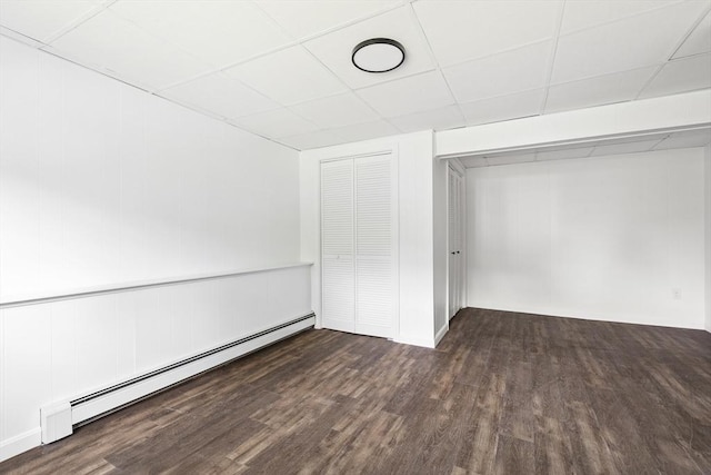 24 Roosevelt St, Taunton, MA 02780 - unfurnished bedroom featuring wood finished floors, a baseboard radiator, a drop ceiling, and a closet