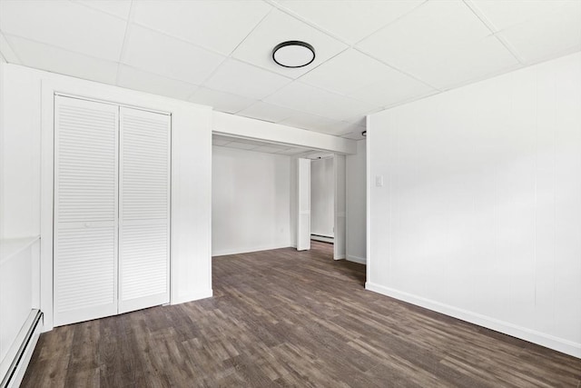 24 Roosevelt St, Taunton, MA 02780 - unfurnished bedroom with a baseboard radiator, wood finished floors, a drop ceiling, baseboards, and a closet