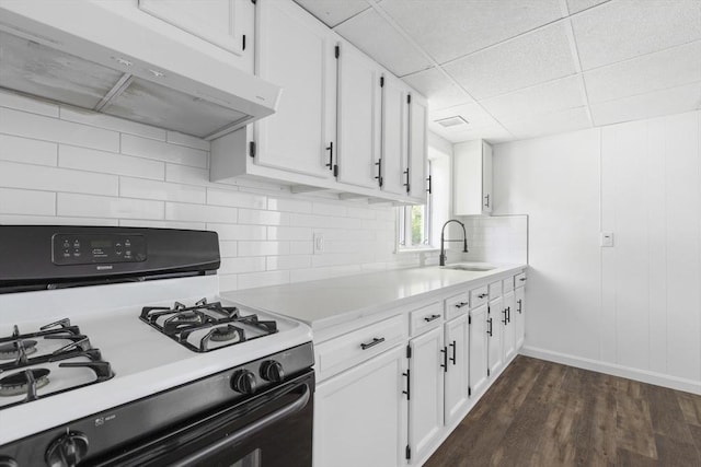 24 Roosevelt St, Taunton, MA 02780 - kitchen with range with gas cooktop, under cabinet range hood, a sink, light countertops, and white cabinets