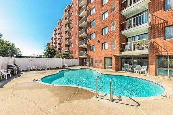 30 Revere Beach Pkwy Unit 207, Medford, MA 02155 - community pool featuring a patio area