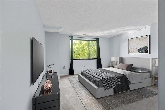 30 Revere Beach Pkwy Unit 207, Medford, MA 02155 - bedroom featuring a textured ceiling and carpet flooring