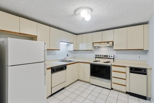 30 Revere Beach Pkwy Unit 207, Medford, MA 02155 - kitchen featuring white appliances, under cabinet range hood, cream cabinets, light countertops, and a textured ceiling