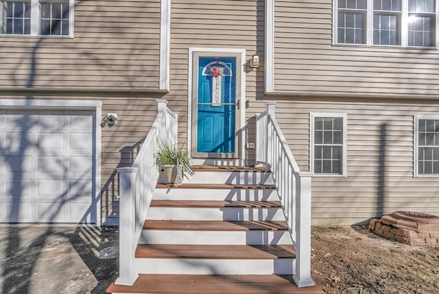 doorway to property with a garage