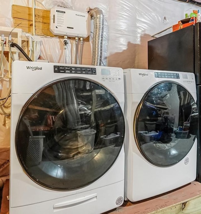 laundry area featuring laundry area and washer and clothes dryer